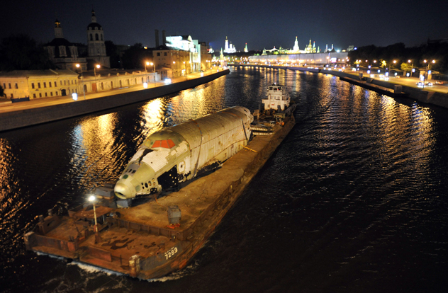 A Russian space shuttle 'Buran' (Snowstorm) is transported on a barge along the Moskva River in downtown Moscow, early on June 23, 2011, as the spacecraft is shipped away from the Gorky Park, where it was used as an attraction. According to the park director Sergei Kapkov the Gorky Park Buran, which was created as the structural and test vehicle and never flew in space, will be on display outside the Space Pavilion at the All-Russian Exhibition Center (VTTS). AFP PHOTO / ANDREY SMIRNOV