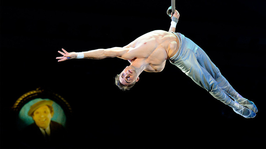 Aerial gymnast Sergei Akimov performs during the new Golden Season program at the Nikulin Circus on Tsvetnoy Boulevard