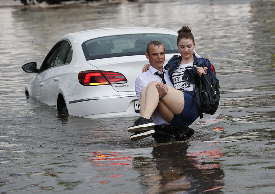 Hero In Suit Rescues Women From Flash Flood In World Cup Host City Photos Russia Beyond