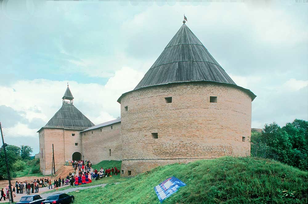 Staraya Ladoga Fortress. West wall with Vorotnaya Tower (left) & Clement Tower. Restored in 1976.  August 16, 2003.