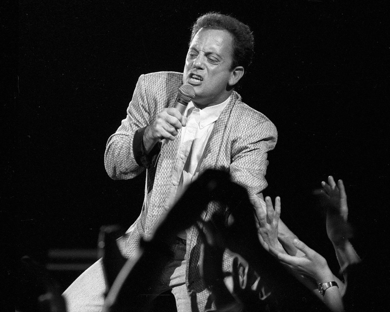 Why did Billy Joel destroy his piano when performing for Russians