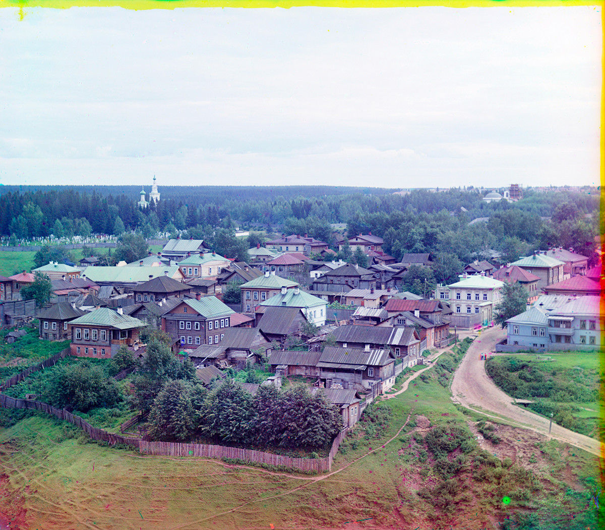 Perm. View northeast from City Hillocks. Razgulyai district with wooden houses. Background: Yegoshika Cemetery. Summer 1909 