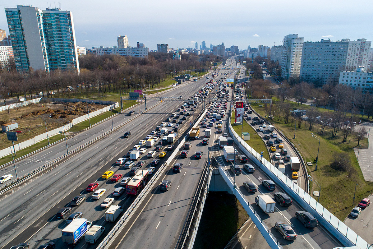  A traffic jam as police check IDs and passes of each person driving into Moscow at a checkpoint at the entrance to Moscow, Russia, Wednesday, April 15, 2020