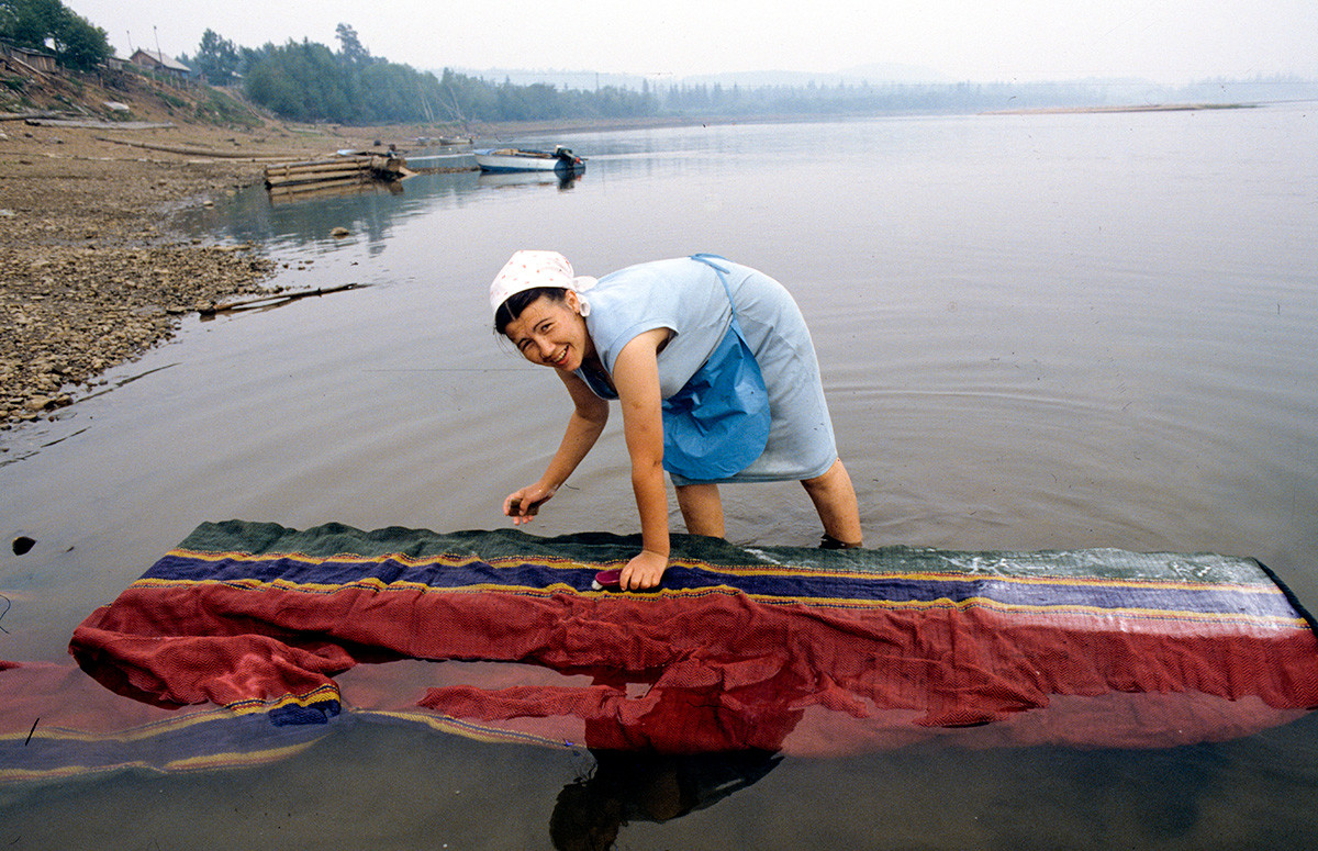 Washing a carpet, Krasnoyarsk Region.