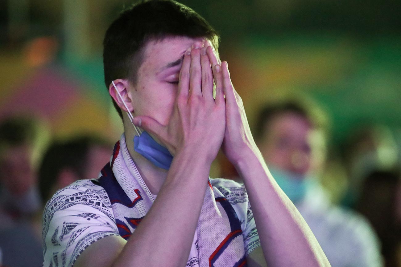 A fan during the broadcast of the Euro 2020 European Football Championship match between Belgium and Russia.