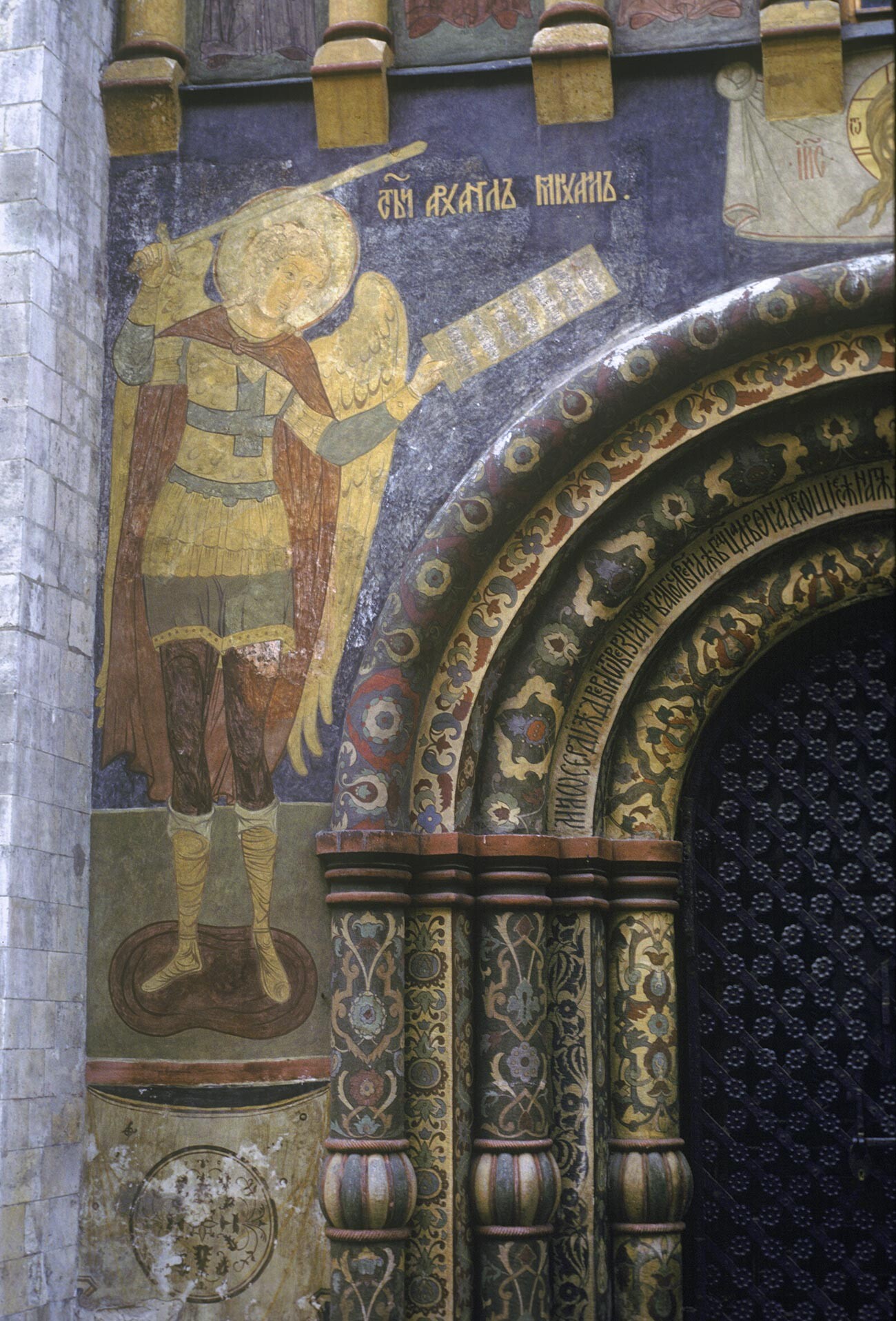 Dormition Cathedral. North facade, portal, left side. Fresco of Archangel Michael. August 6, 1987