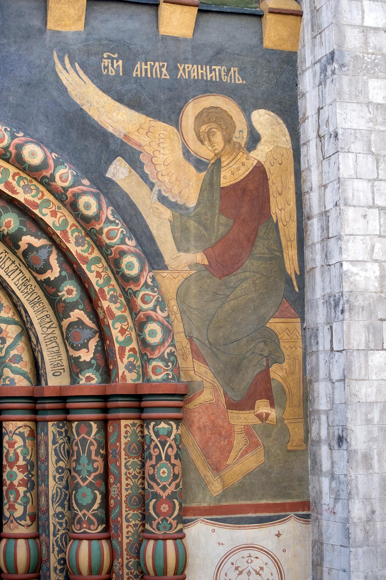 Dormition Cathedral. North facade, portal, right side. Fresco of guardian angel. June 17, 2012