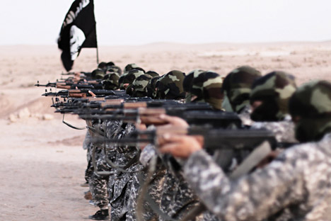 ISIS masked militants firing weapons, Nov. 19, Raqqa, Syria. 