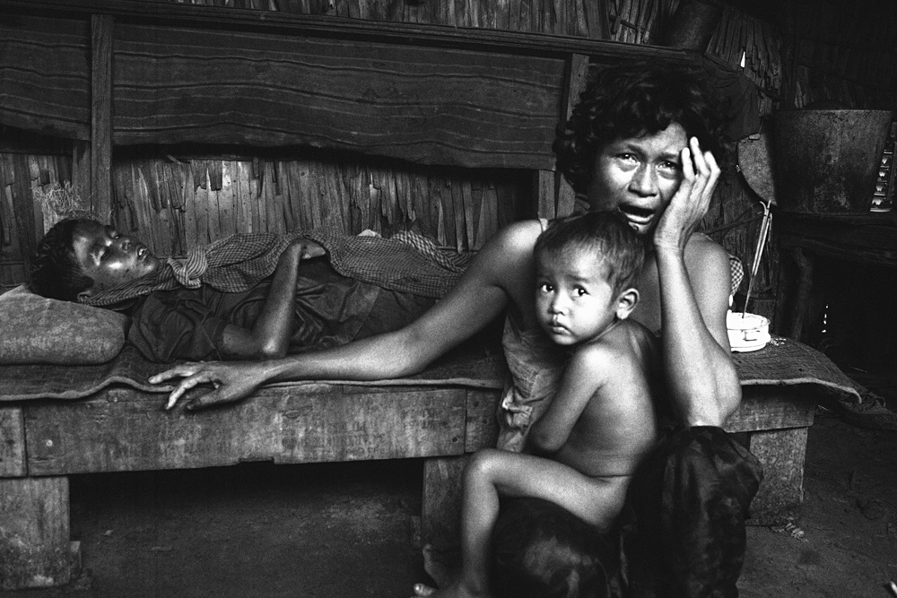 Her son a victim of an insurgent mortar attack, a Cambodian mother cries in grief following the attack on a hamlet in the Kompong Speu area in Cambodia Oct. 20, 1974. 
