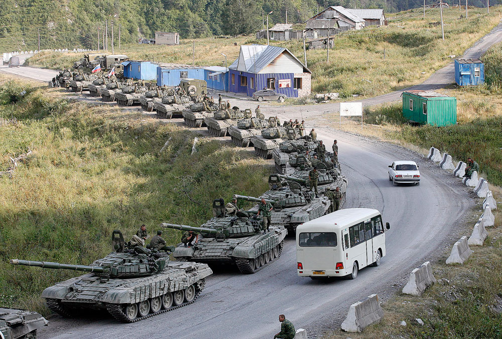 A column of Russian armoured vehicles moves along aroad in South Ossetia, near the border with North Ossetia August 23, 2008. Source: Reuters