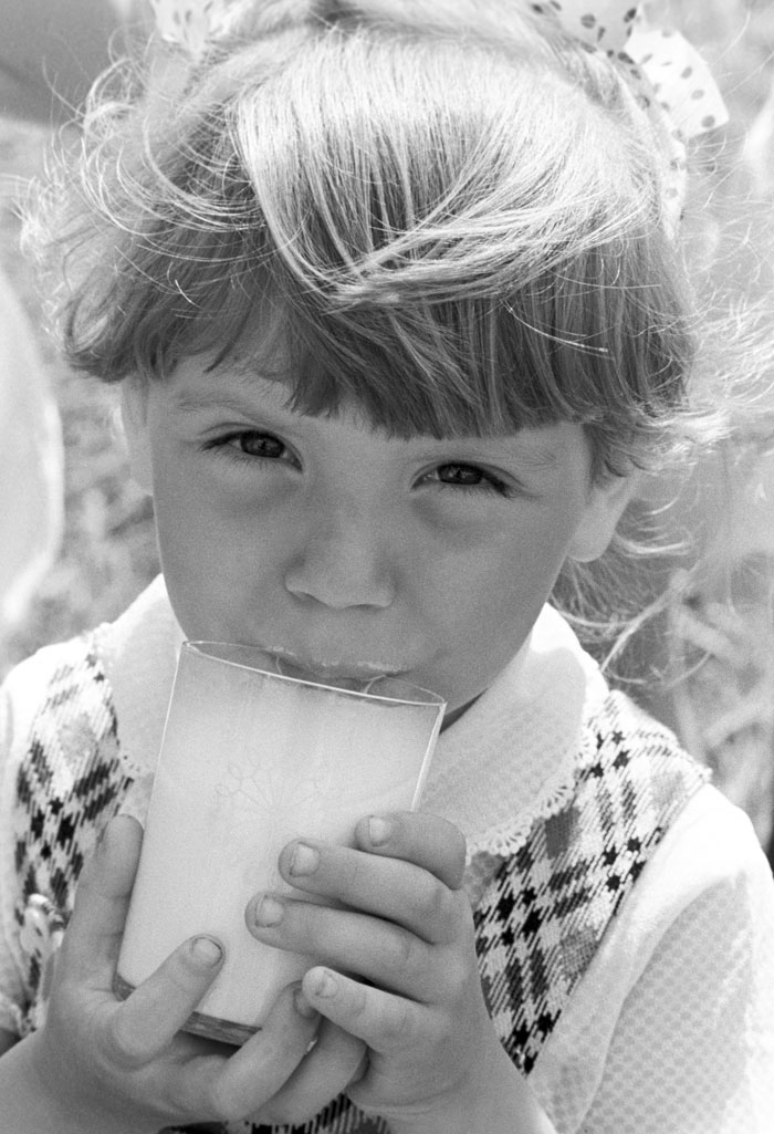 1984. A girl drinks milk at a kindergarten attached to the Lenino stud farm (now Belarus).  