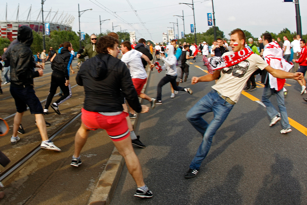 A Polish supporter (right) challenges Russian football fans in Warsaw June 12, 2012. Source: Reuters