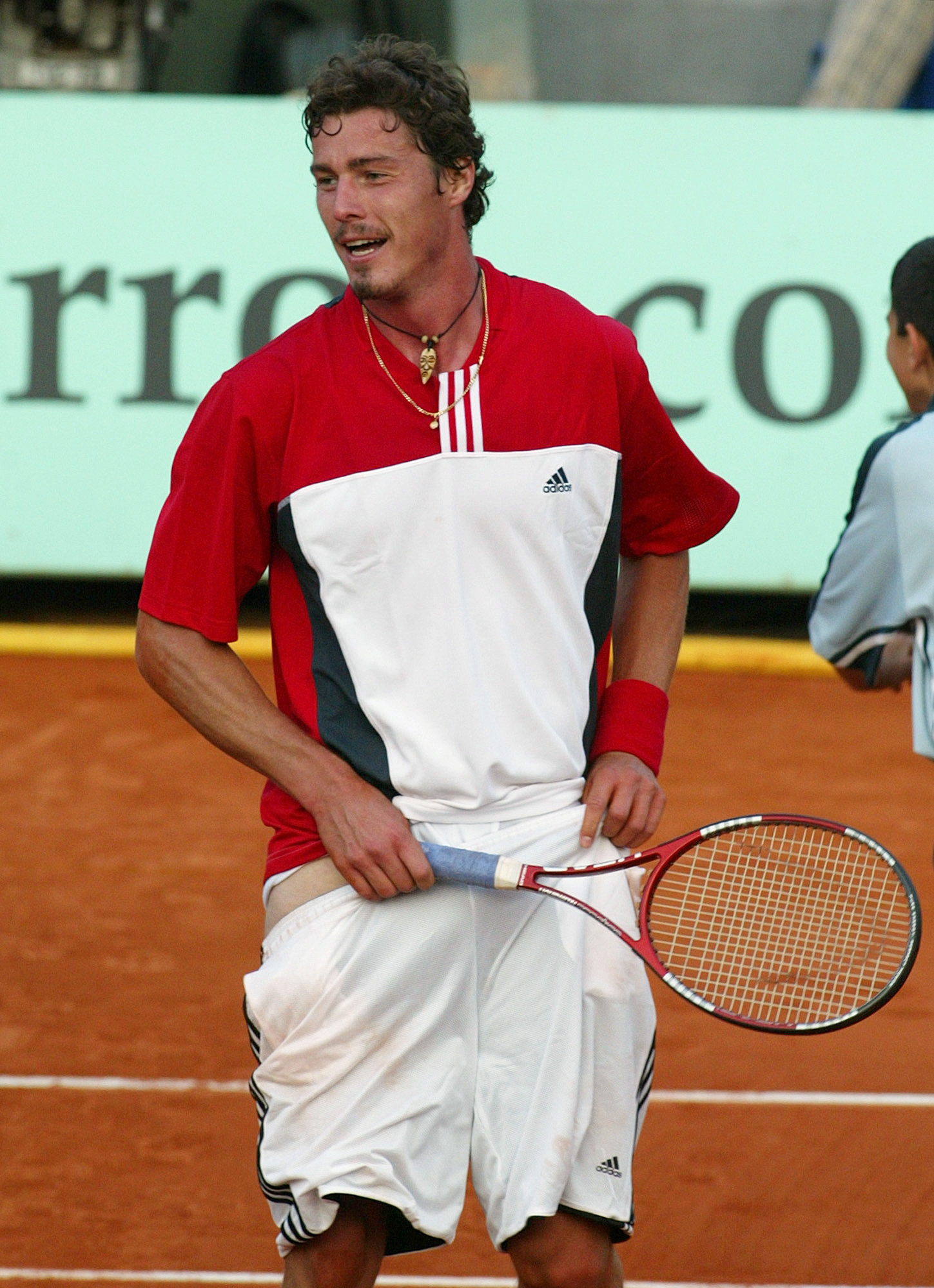 Marat Safin acts as if he was taking off his shorts after loosing a point against Felix Mantilla of Spain during their second round match of the French Open tennis tournament at the Roland Garros stadium in Paris, May 27, 2004. 
