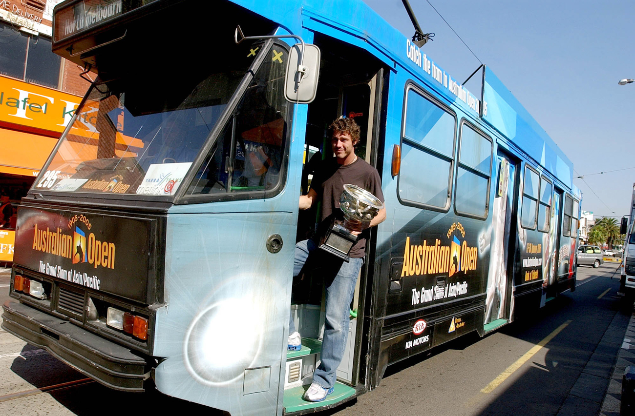 Russia&#39s Marat Safin holds his Australian Open trophy on a Melbourne tram, in Australia, Monday, Jan. 31, 2005. Safin defeated Australia&#39s Lleyton Hewitt to win his first Australian Open title at Melbourne Park on Jan. 30. 