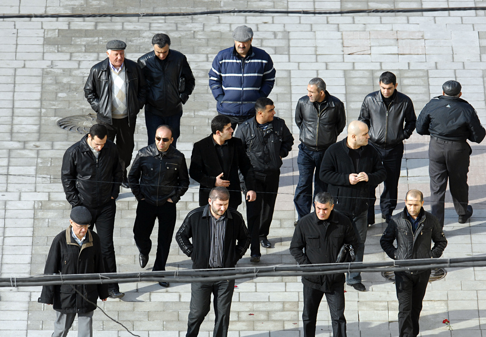 People attend the burial service for Russian mafia boss Vyacheslav Ivankov, nicknamed Yaponchik (or Little Japanese), at Moscow's Vagankovskoye cemetery on October 13, 2009.