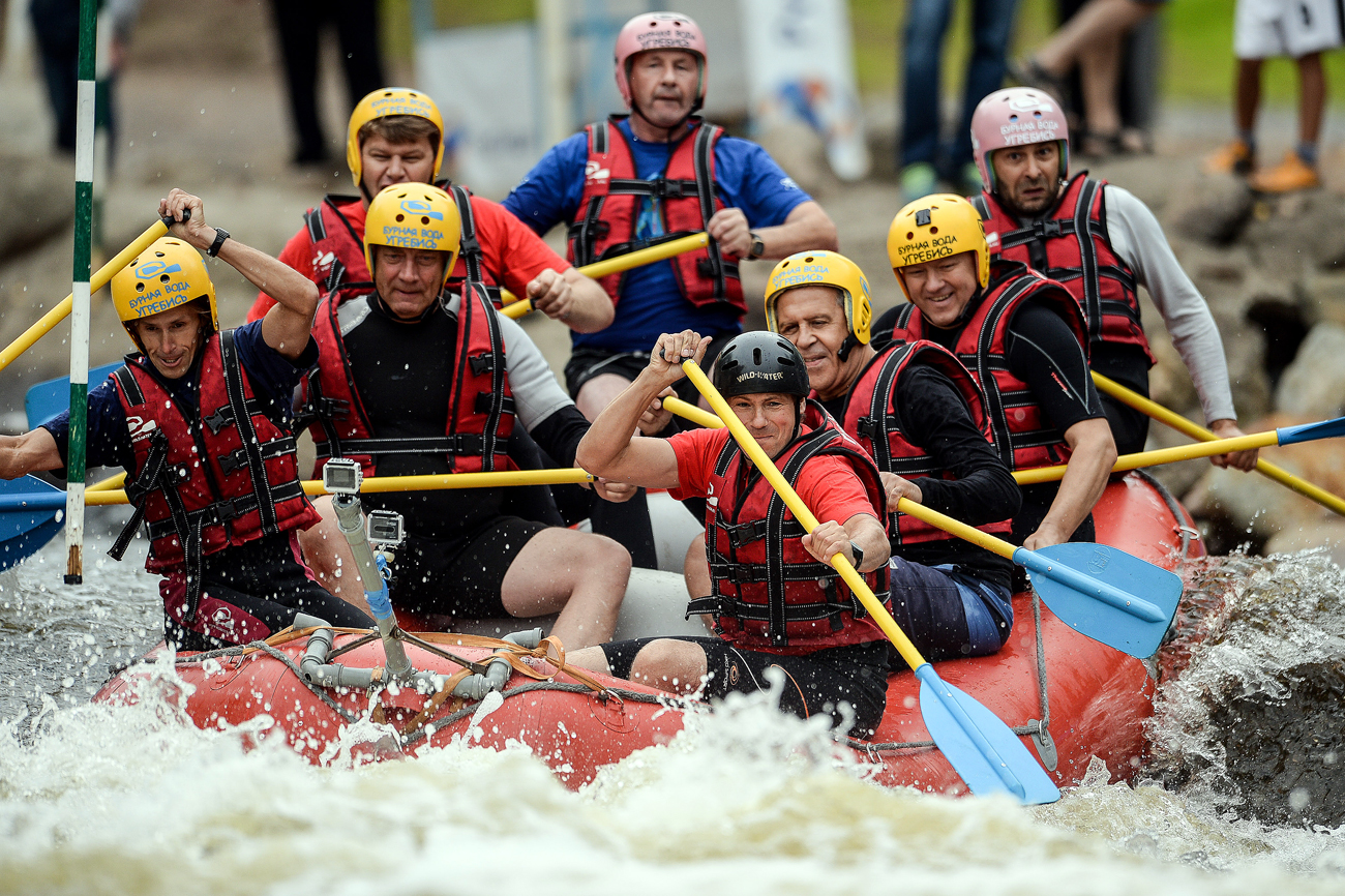 Russia's Foreign Minister Sergei Lavrov, third right, floats in a raft along the track of the Whitewater rafting regional center in Okulovka, the Novgorod region. Source: Konstantin Chalabov / RIA Novosti