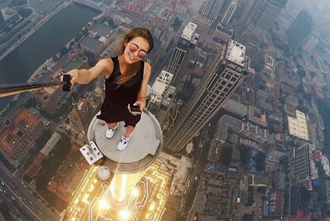 Fearless Russian daredevil girl reaches for the sky