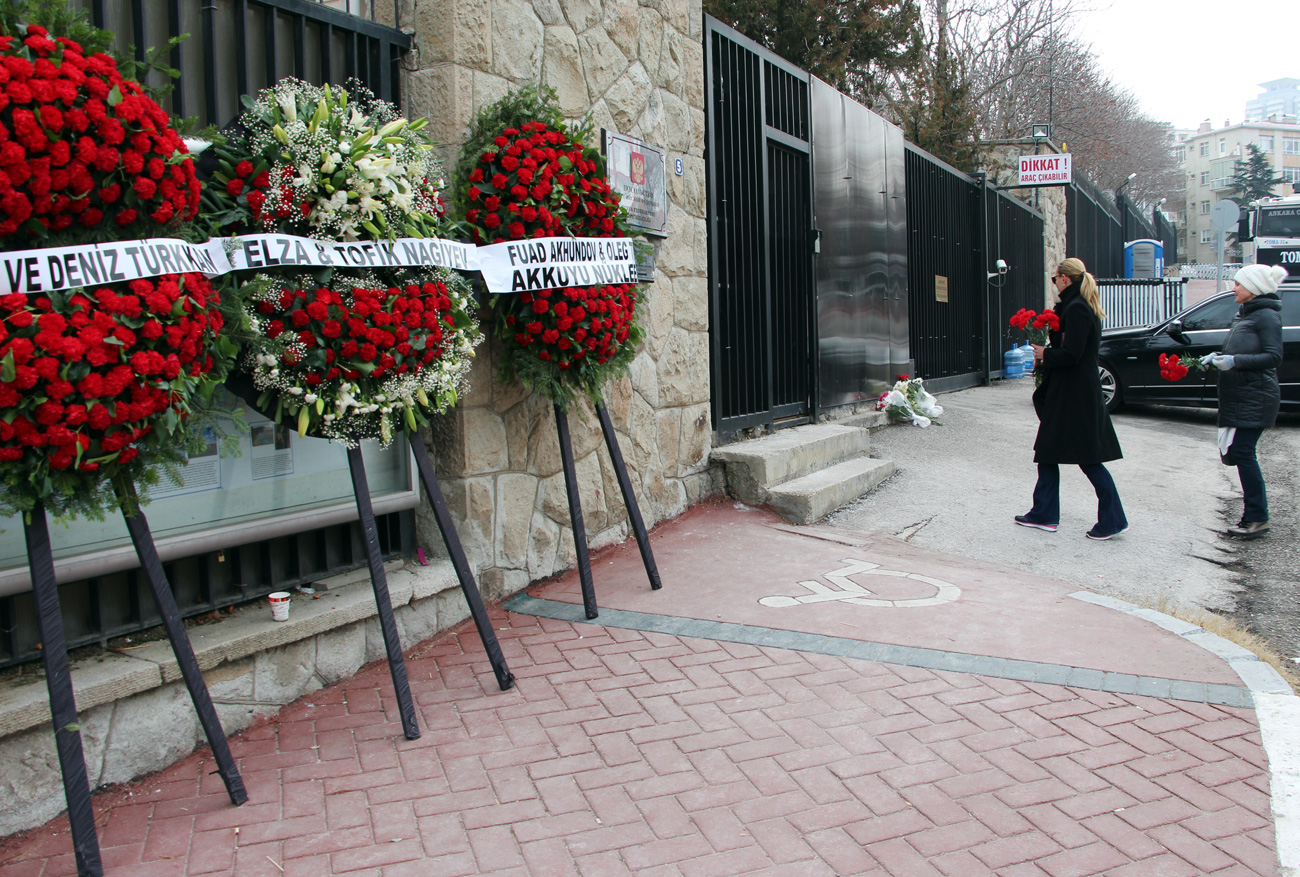 People bring flowers to sealed off Russian embassy in Ankara