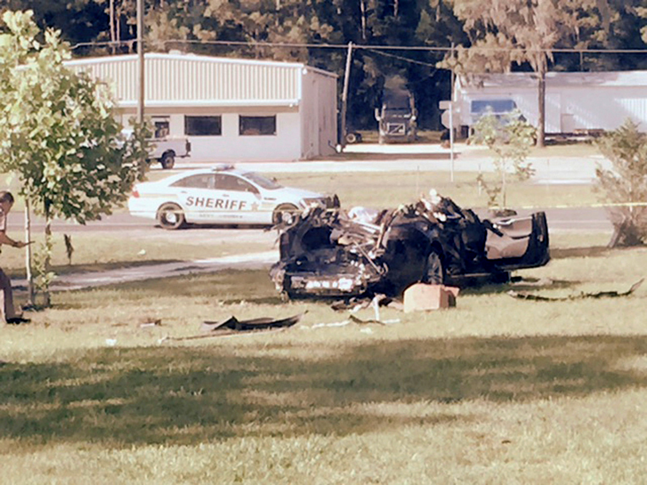 A Tesla Model S involved in the fatal crash on May 7, 2016 is shown with the top third of the car sheared off by the impact of the collision of the Tesla with a tractor-trailer truck on nearby highway and came to rest in the yard of Robert and Chr / Source: Reuters