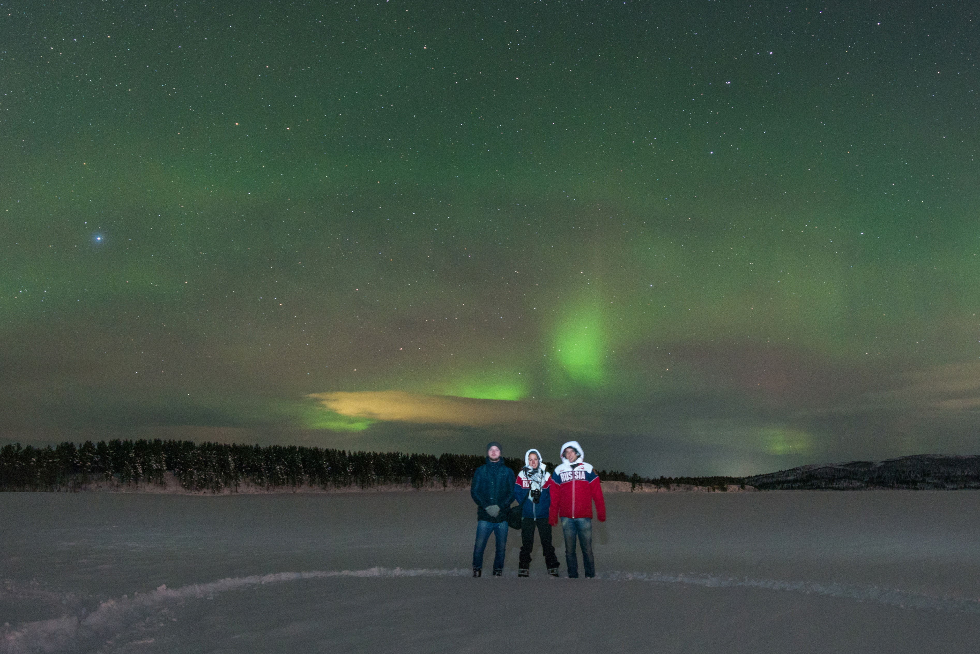 "We stopped near a large field and everyone marched through the snow to the spot that would serve as the vantage and photo point. There were about 30 people that evening eager to see the Northern Lights that night. And see them we did!" Source: Maria Stambler