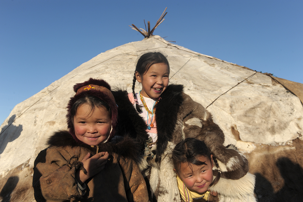 Chukchi girls near their chum. Photo credit: RIA Novosti/Sergei Guneev