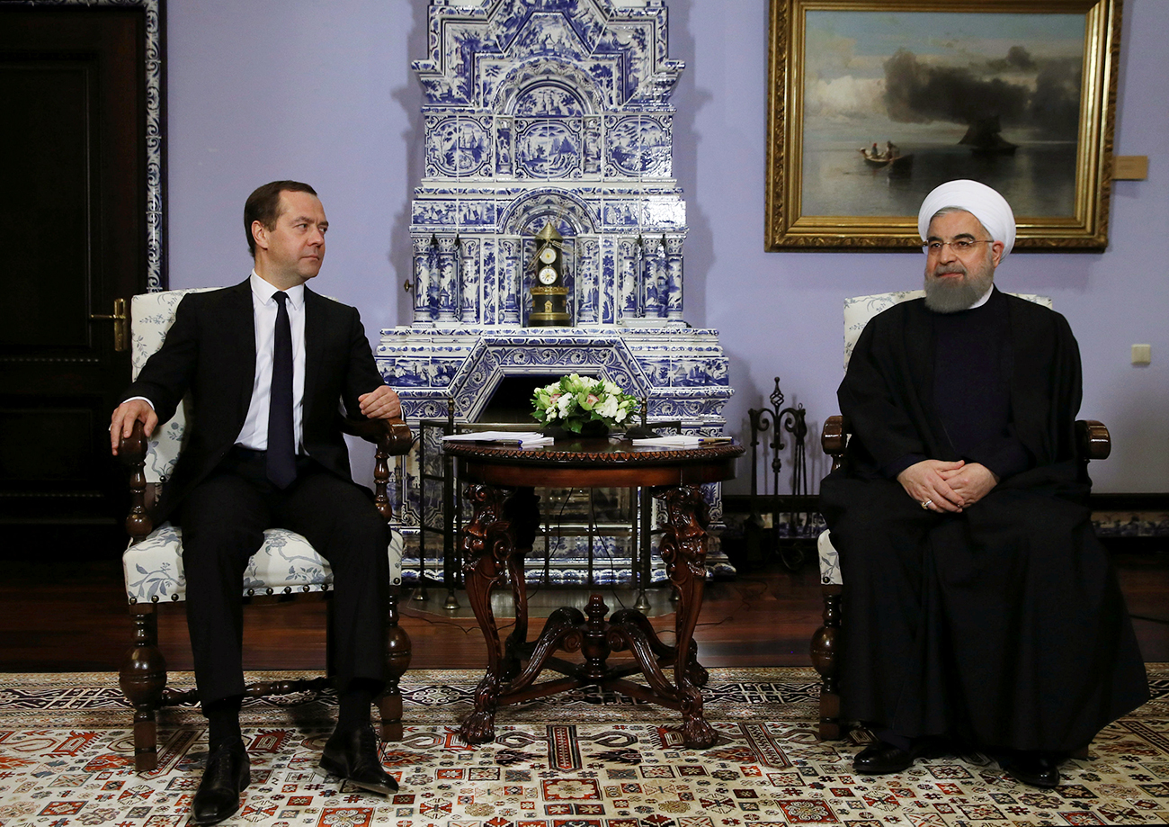 Russian Prime Minister Dmitry Medvedev meets with Iranian President Hassan Rouhani at the Gorki state residence outside Moscow, Russia. Source: Reuters