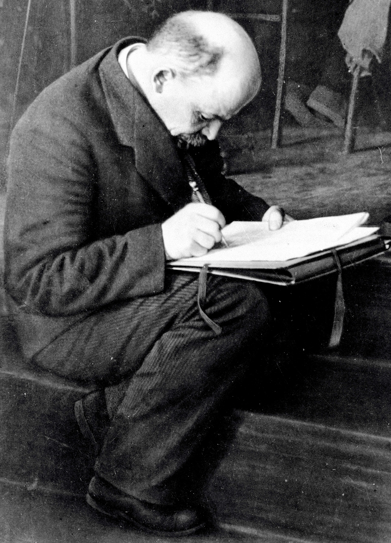 Vladimir Lenin on rostrum steps is making notes during the meeting of the III Comintern Congress in the former Andreyevsky Hall of the Kremlin. Source: Karl Bulla/RIA Novosti