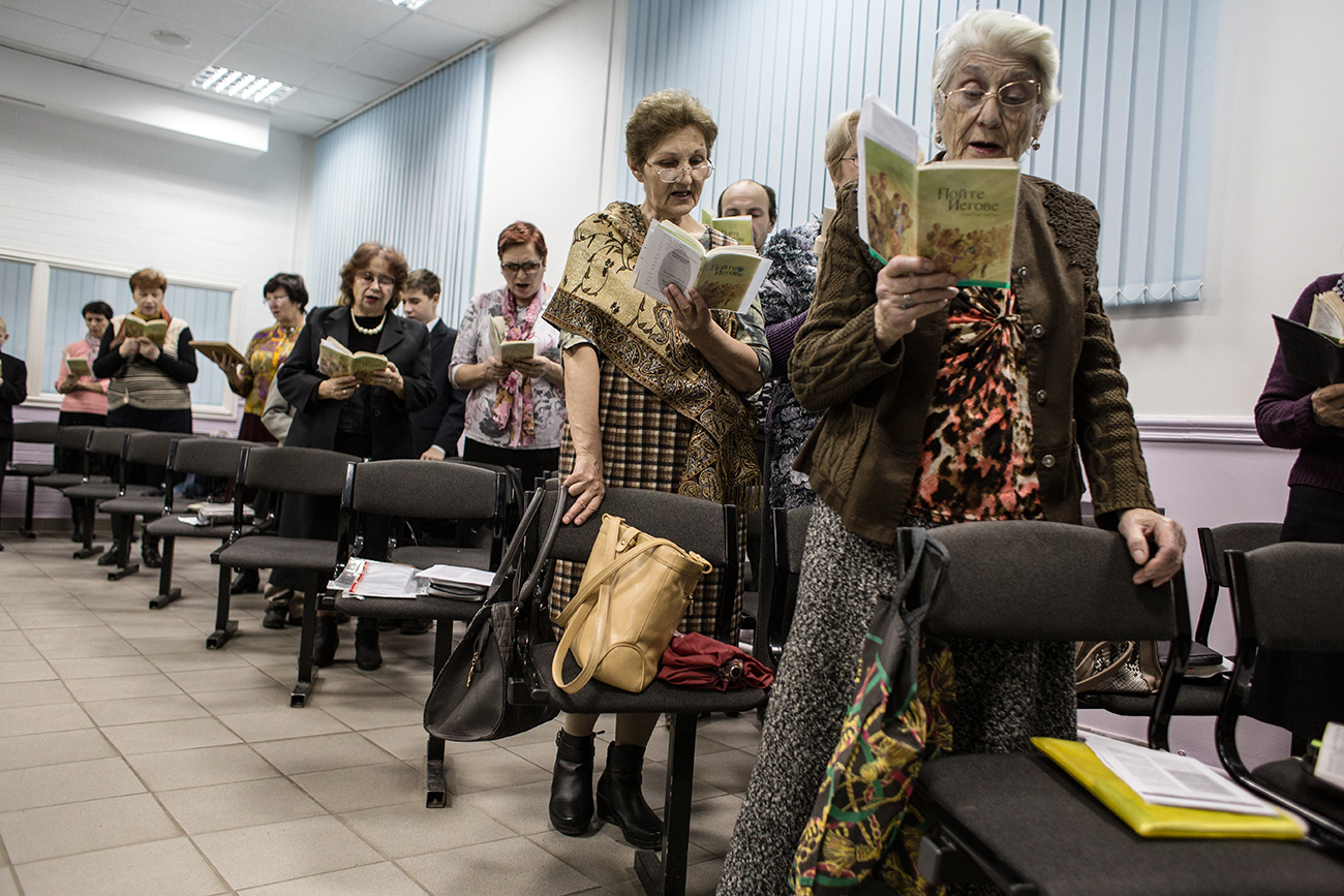 During church services adherents listen to sermons and the teachings of Jehovah, and also sing. Source: Getty Images