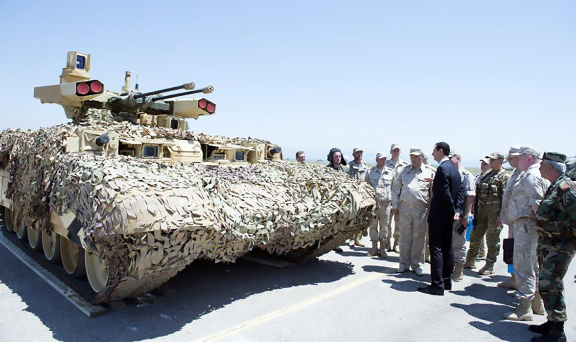 Syria's President Bashar al-Assad stands in front of the BMPT-72 at the Russian air base at Hmeymim on June 27, 2017. Source: Reuters