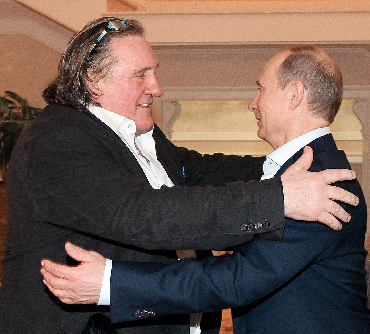 President Vladimir Putin, right, and French actor Gerard Depardieu, who has been handed his new Russian passport, meet in Sochi. Source: Michael Klimentyev/RIA Novosti