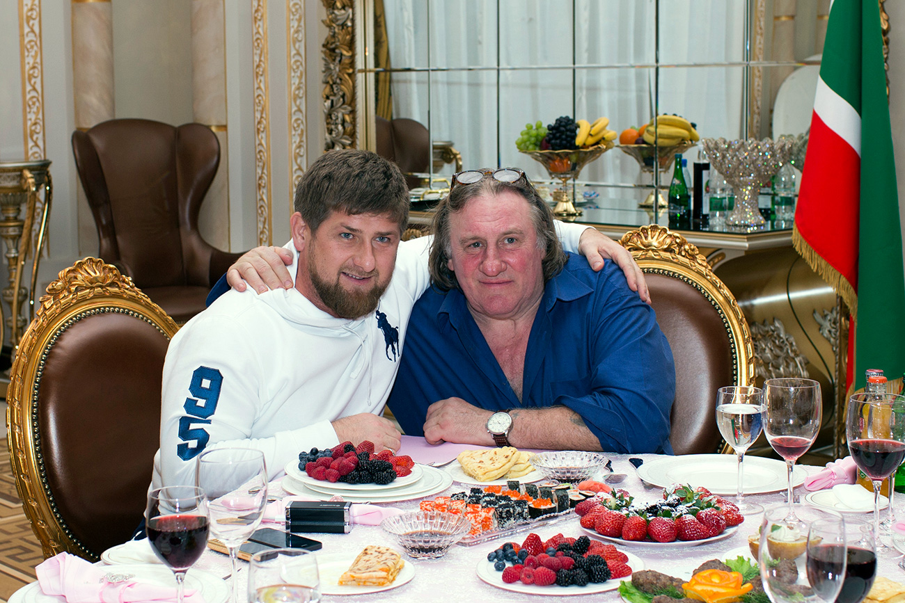 Actor Gerard Depardieu (R) poses for a picture with Chechen President Ramzan Kadyrov during a meeting at the presidential residence as he visits the capital of the Chechen Republic, Grozny, in Febuary 2013. Source: Reuters