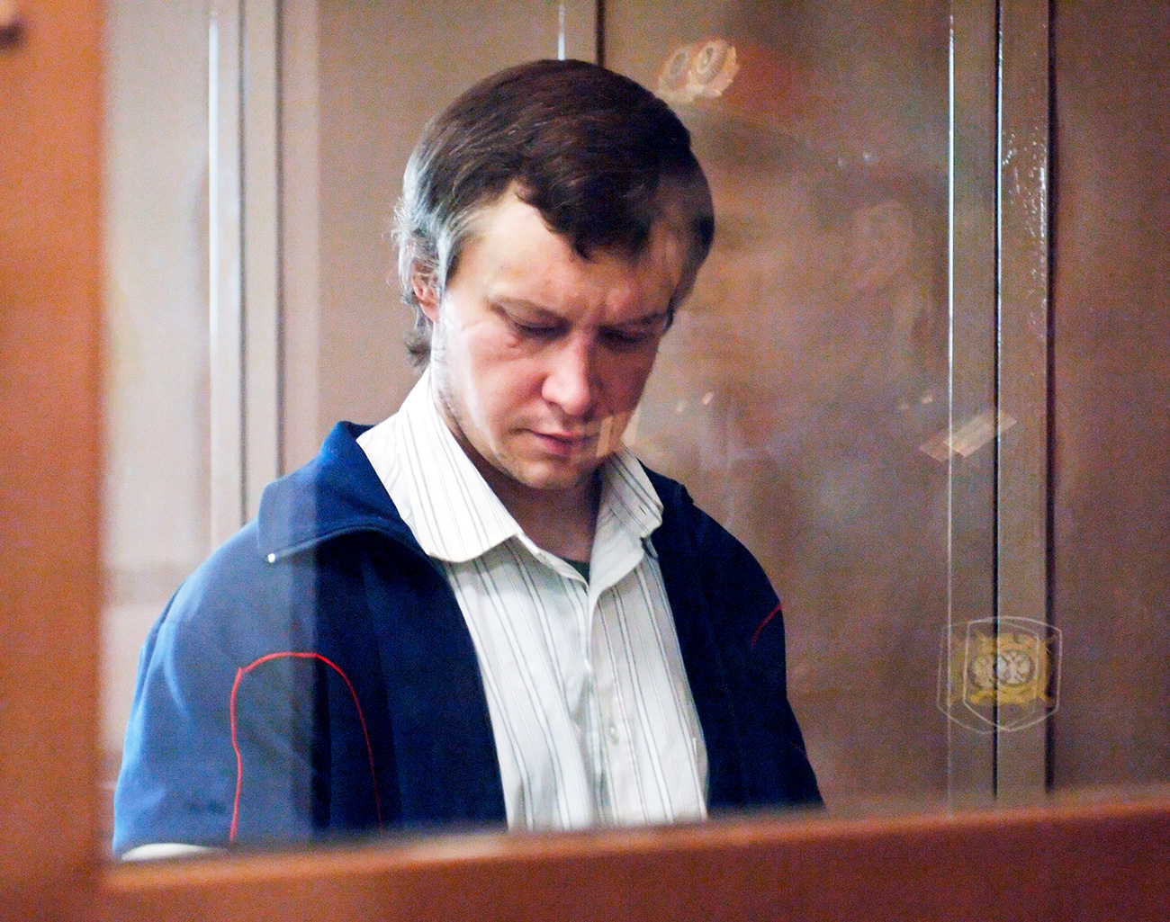 Serial killer Aleksandr Pichushkin in the defendant’s cage. / Yuri Mashkov/TASS