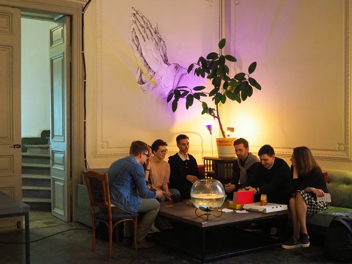 Vlad with friends playing table games in an anti-cafe. Source: Ruslan Shamukov