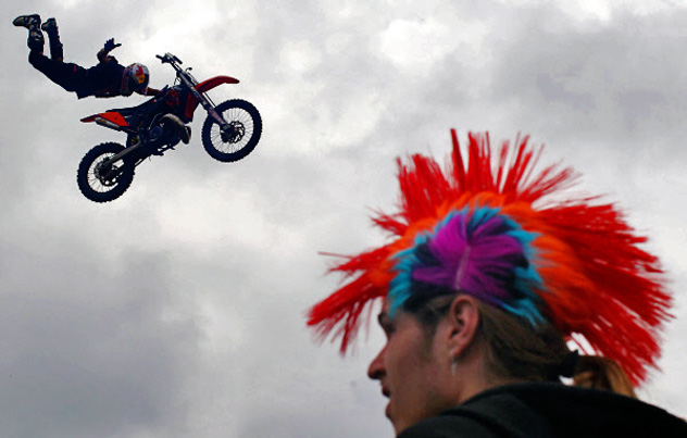 Visitors watch Red Bull X-Fighters Jams' bikers perform at the 10th rock festival Nashestviye 2011 in Tver Region.