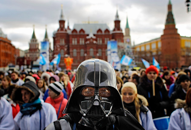 A member of the pro-Kremlin youth movement Stal (Steel) wearing a Darth Vader mask participates in a rally in downtown Moscow, Tuesday, Dec. 6, 2011. Later in the day a group  of people (from 1,500 to 5,000, according to different reports)  gathered in Triumfalnaya Square to protest the results of the election. Prime Minister Vladimir Putin said on Tuesday that he's satisfied with the performance of his party in Russia's parliamentary election, even though United Russia lost a significant number of seats. He added that a drop in support is "inevitable" for any ruling party. The statement came as U.S. Secretary of State Hillary Rodham Clinton criticized once more the outcome of the election. Source: AP