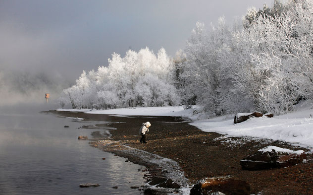 A curious child walking along the bank of the Yenisei River, about 42 km southward from Russia's Siberian city of Krasnoyarsk. Source: Reuters/Vostock-Photo   