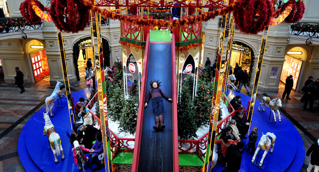 A girl sliding  down from a the carousel in GUM, Russia's biggest store located at the Red Square in Moscow. Source: AFP/ East News