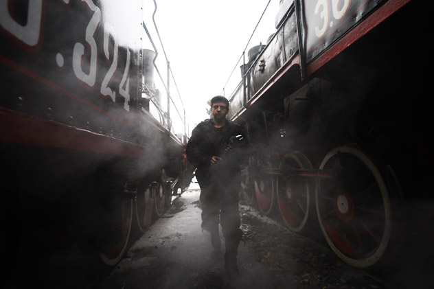 A railway worker examining wagons at St. Petersburg's Russian Railways (RZD) depot, responsible for  the repair and technical services of steam engines. Source: RIA Novosti/Vadim Zhernov