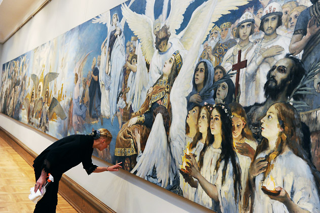 A researcher observes the preliminary drawing for the "Joy righteous God. Triptych" [I think this is how it's officially called] at an exhibition of Viktor Vasnetsov's "Sketches to 1885-1896 wall paintings in the St.Volodymir's Cathedral, Kiev" at the Tretyakov Gallery. Source: Vladimir Vyatkin/RIA Novosti