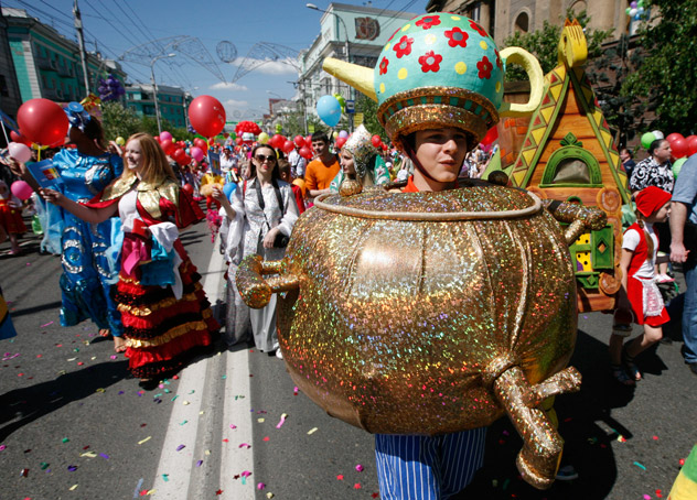 People walk during the City Children's Carnival in the centre of Russia's Siberian city of Krasnoyarsk June 1, 2012. More than 3,000 children, their relatives and teachers took part in the procession to celebrate International Children's Day, according to organizers. Source: Reuters