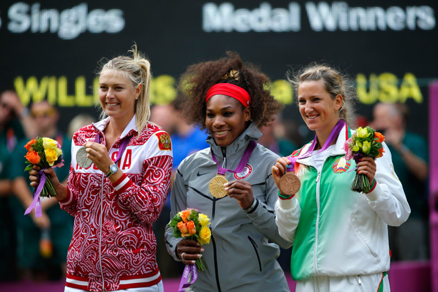 Serena Williams of the U.S. poses with the silver medal winner, Russia's Sharapova, and bronze medallist Azarenka of Belarus at the All England Lawn Tennis Club during the London 2012 Olympic Games. Source: Reuters / Mike Blake