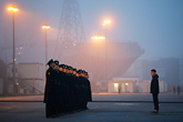 Russian sailors stand in formation in front of the Mistral-class helicopter carrier Vladivostok in Saint-Nazaire, France
