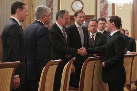 Russian Prime Minister Dmitry Medvedev, right, shakes hands with Foreign Minister Sergey Lavrov as he greets members of his Cabinet in the government headquarters in Moscow, Monday, May 21, 2012. From left, Russian Regional Development Minister Oleg Govorun, Interior Minister Vladimir Kolokoltsev, Foreign Minister Sergey Lavrov, Industry and Trade Minister Denis Manturov, Sports Minister Vitaly Mutko. Source: AP