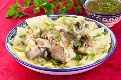 Beshbarmak, the boiled meat, is usually diced with knives, often mixed with boiled noodles, and spiced with onion sauce. It is usually served in a big round dish. Source: Lori / Legion Media 