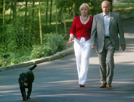 Russian President Vladimir Putin and his wife Lyudmila, walk preceded by their Labrador, Koney, at Putin's residence in the Russian Black Sea resort of Sochi, in this Sept. 14 , 2003 photo. The dog just had puppies.
