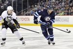 Russian hockey players stick with their NHL clubs