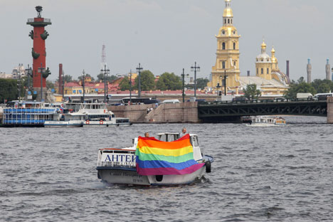 A boat carrying a rainbow flag sails on the Neva River during a gay rights activists' protest in St. Petersburg, on July 25, 2011. Source: AP Photo / Dmitry Lovetsky