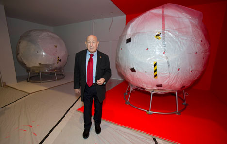 Cosmonaut Alexei Leonov in front of Vostok 6 in the Cosmonauts exhibition 