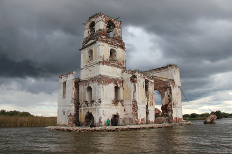 Russians fight to keep derelict church from sinking beneath the waters 